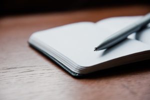 Stock image of notebook and pen